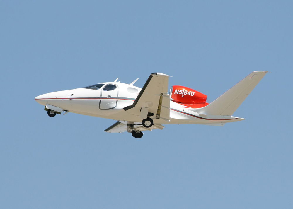 The motion of this Eclipse Concept jet can be described in terms of the distance it has traveled (a scalar quantity) or its displacement in a specific direction (a vector quantity). In order to specify the direction of motion, its displacement must be described based on a coordinate system. In this case, it may be convenient to choose motion toward the left as positive motion (it is the forward direction for the plane), although in many cases, the \(x\)-coordinate runs from left to right, with motion to the right as positive and motion to the left as negative. (credit: Armchair Aviator, Flickr) A small jet airplane flying toward the left.