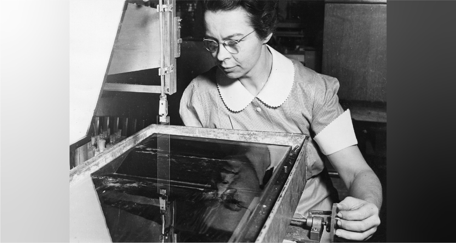 Katherine Burr Blodgett using equipment